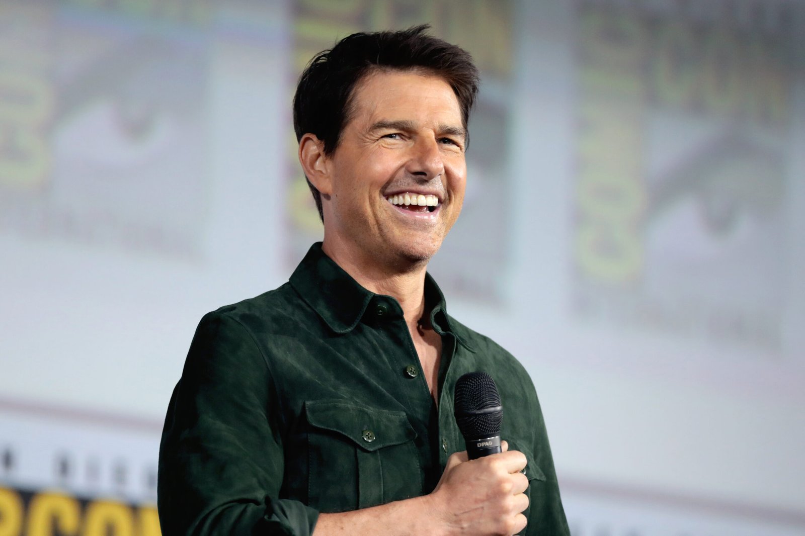 Tom Cruise speaking at a 2019 fan convention panel