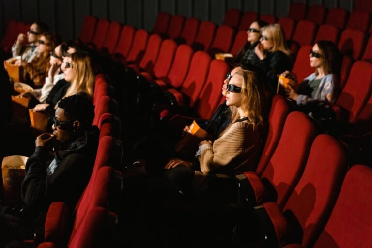 Audience watching a film in a crowded movie theater