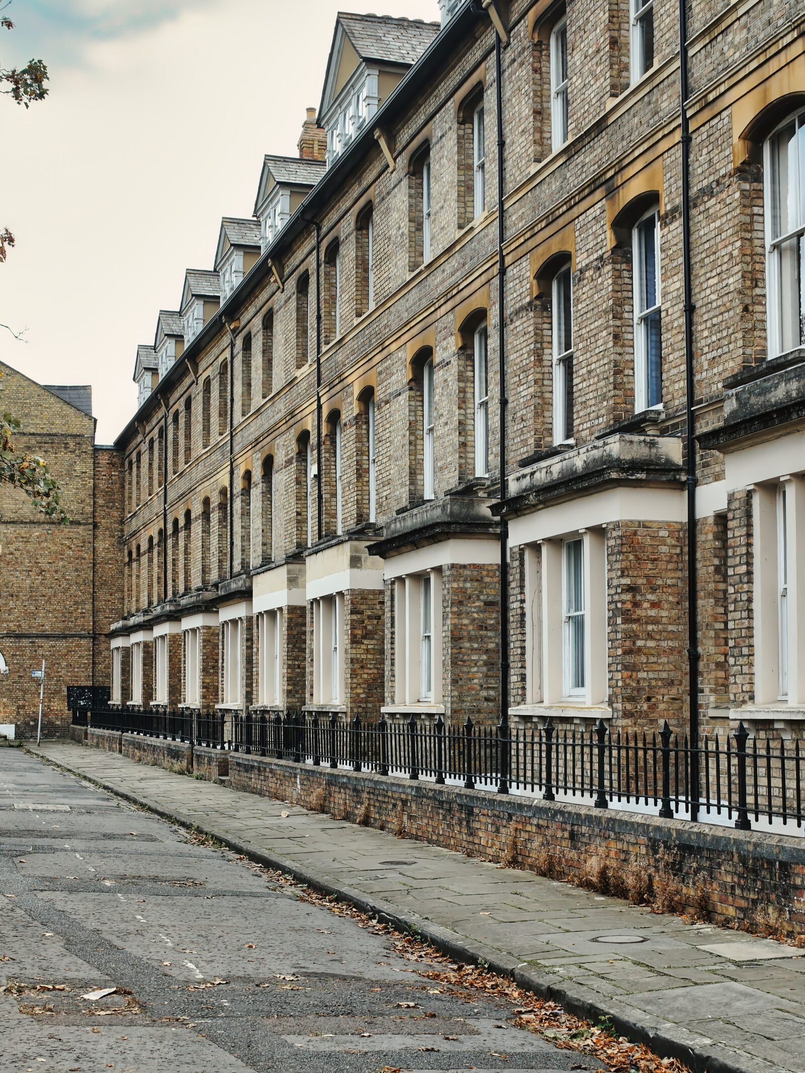 Illustrative brick terraced houses, not Jodie Comer's actual residence