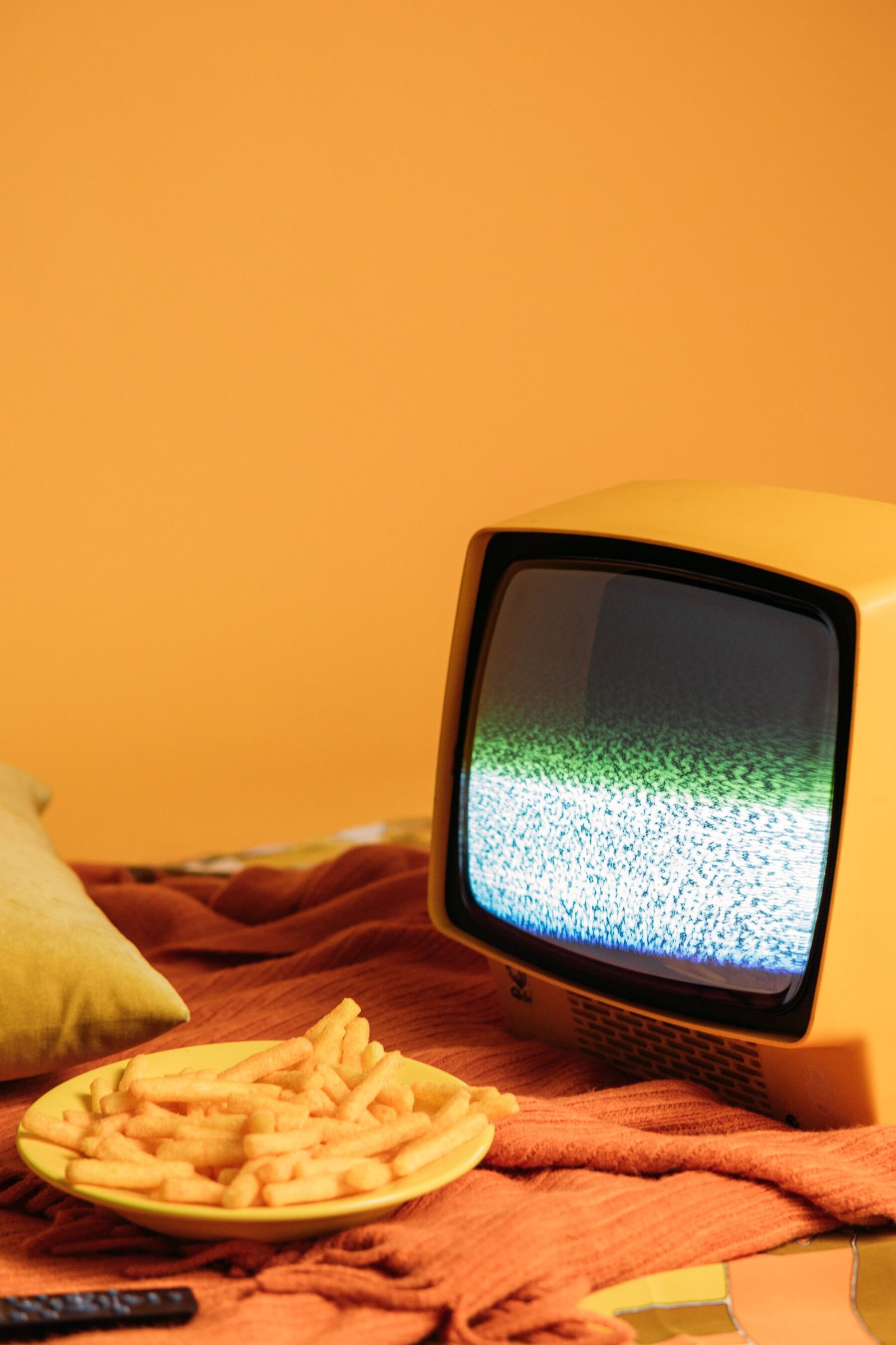 A vintage television showing static/snow on its screen